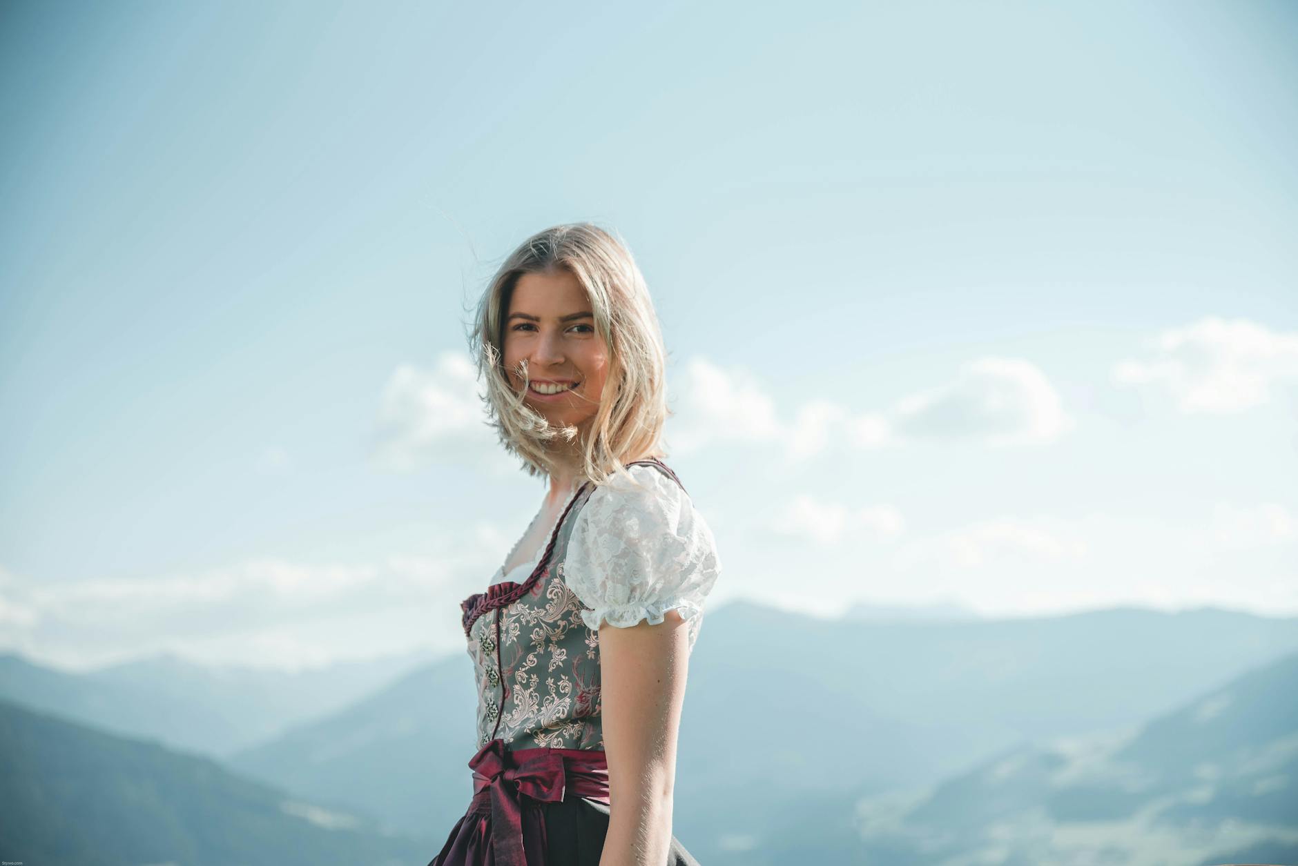 https://www.pexels.com/photo/smiling-woman-wearing-white-and-green-floral-cuff-shoulder-dress-1428962/